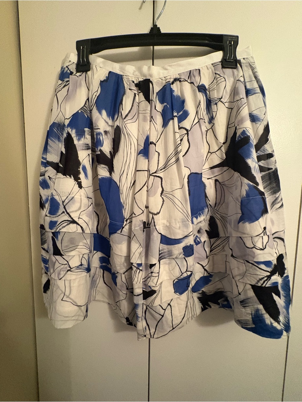 House of Monaco White Floral Skirt with Blue and Black Accents. 6. Abstract.